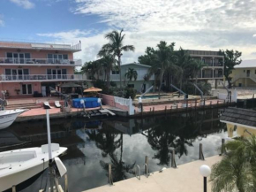 Beautiful Canal front Home with Above Ground Pool, Dock and Fish Station home